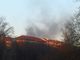 Tetto in fiamme in corso Belgio: colonna di fumo si vede da tutta la città