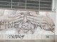 Scritta nazista su un murale alla scuola Collodi di Pinerolo